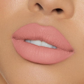 Kylie Cosmetics KOKO K on-model lips showing pale pink finish and defined liner for flattering wear