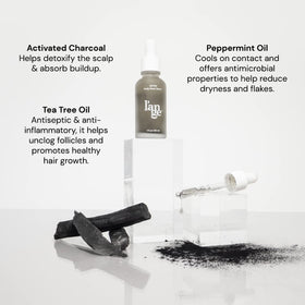 L'ANGE HAIR charcoal serum texture close-up highlighting lightweight absorption benefit