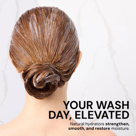 L'ANGE HAIR conditioner being rinsed in shower demonstrating smooth detangling