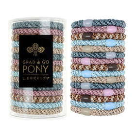 L. Erickson clear tube packaging showing pastel hair ties and tidy storage benefit