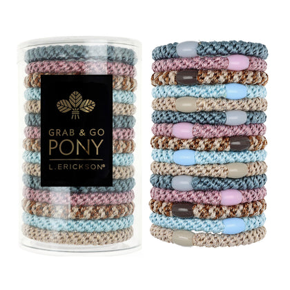 L. Erickson clear tube packaging showing pastel hair ties and tidy storage benefit