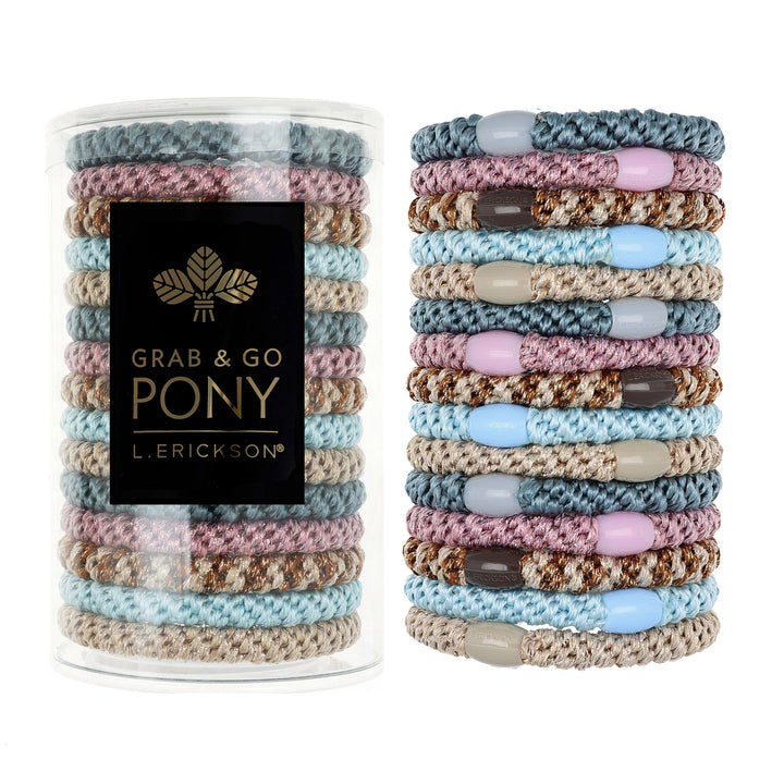 L. Erickson clear tube packaging showing pastel hair ties and tidy storage benefit
