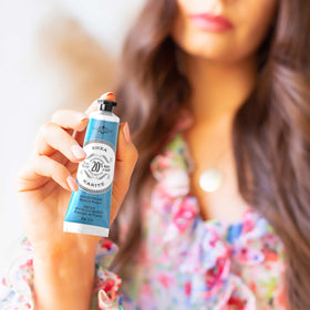 la chatelaine cream being applied to hands demonstrating quick absorption