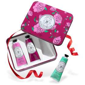 La Chatelaine front packaging set showing three travel tins and elegant box, gifting benefit