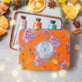 La Chatelaine lifestyle gift setting with tin on a dresser suggesting thoughtful present for mom