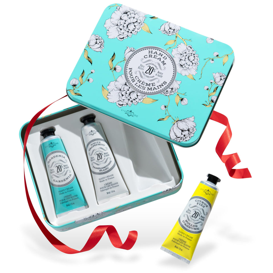 La Chatelaine trio tin front packaging showing three travel hand creams and gifting appeal