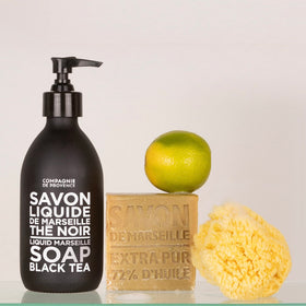La Compagnie de Provence pouring refill to bottle, demonstrates refillable sustainable option