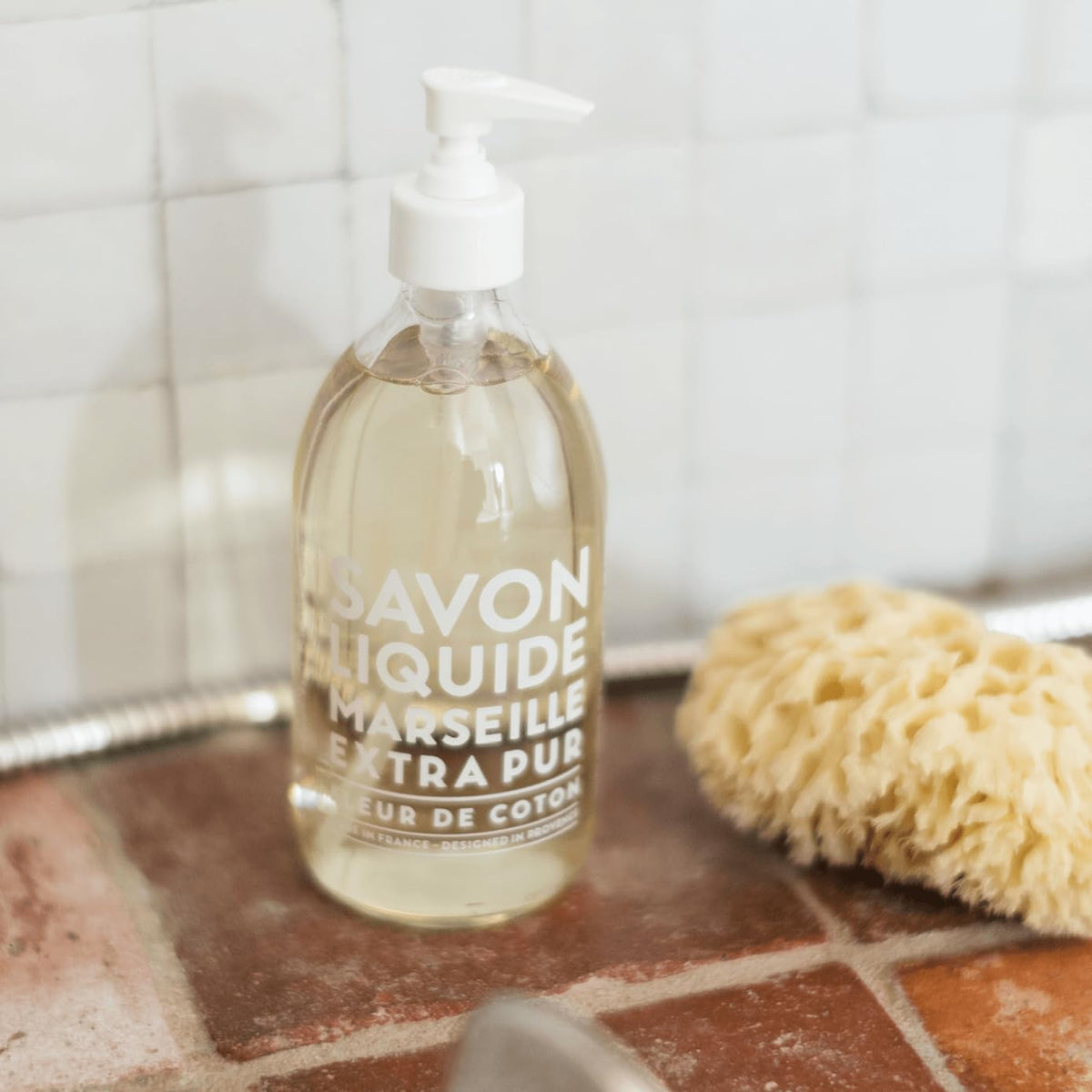La Compagnie de Provence soap lather on hands illustrating gentle cleanse and moisturizing oils benefit