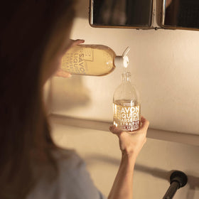 La Compagnie de Provence liquid soap being poured into a dispenser, refill convenience