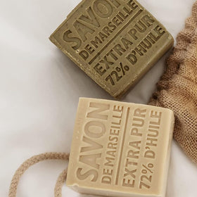 La Compagnie de Provence olive soap cube on bathroom shelf for minimalist zero-waste routine benefit