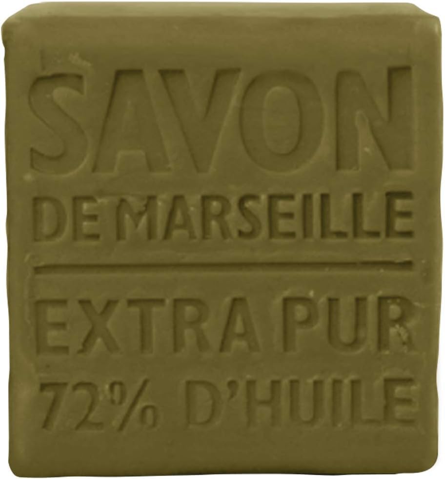 Hand holding La Compagnie de Provence 400g olive cube to show scale and long-lasting value