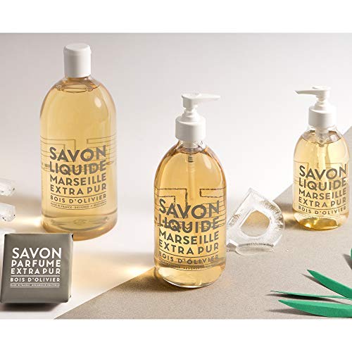 La Compagnie de Provence bottle on bathroom counter lifestyle scene adding warm olive wood fragrance