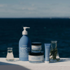 Lifestyle shot of La Compagnie de Provence bottle on bathroom counter adding refined style