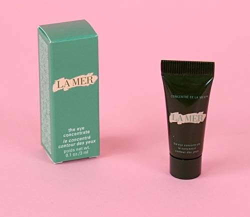 La Mer eye concentrate travel tube in hand demonstrating compact size for travel convenience