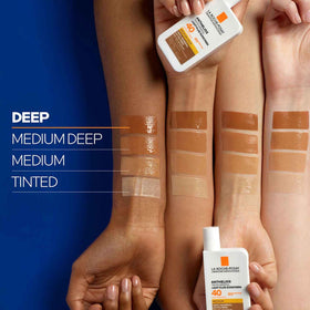 La Roche-Posay applying tinted sunscreen to face to create smooth makeup base