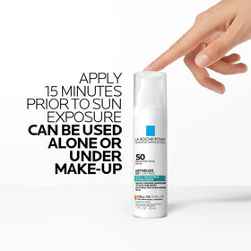 La Roche-Posay bottle staged with sunglasses and hat, suggesting daily sun protection