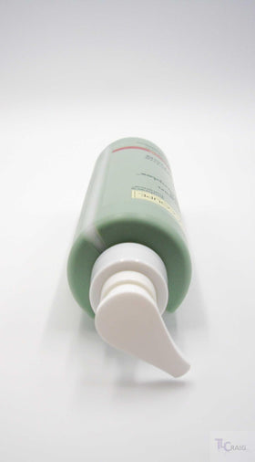LACOUPE lotion shown in hand for size comparison and travel-friendly benefit