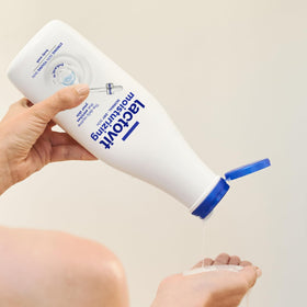 Lactovit gel texture pouring from bottle highlighting hydrating consistency
