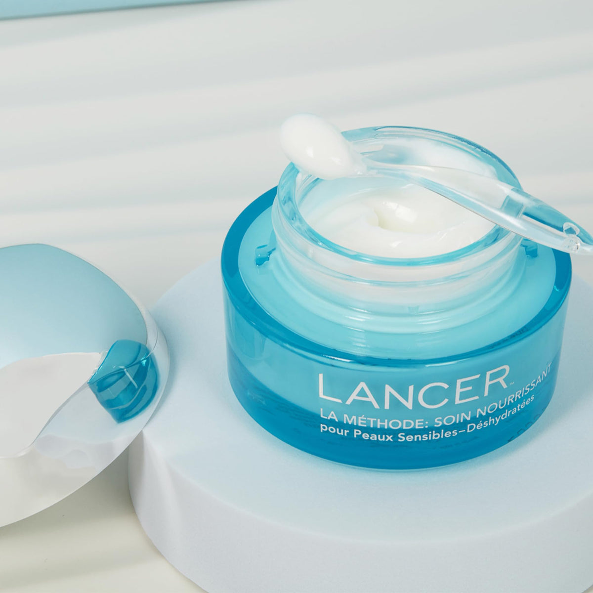 Lancer on bathroom shelf in lifestyle scene suggesting daily use and elegant routine