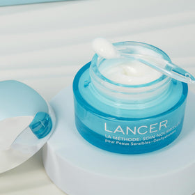 Lancer on bathroom shelf in lifestyle scene suggesting daily use and elegant routine