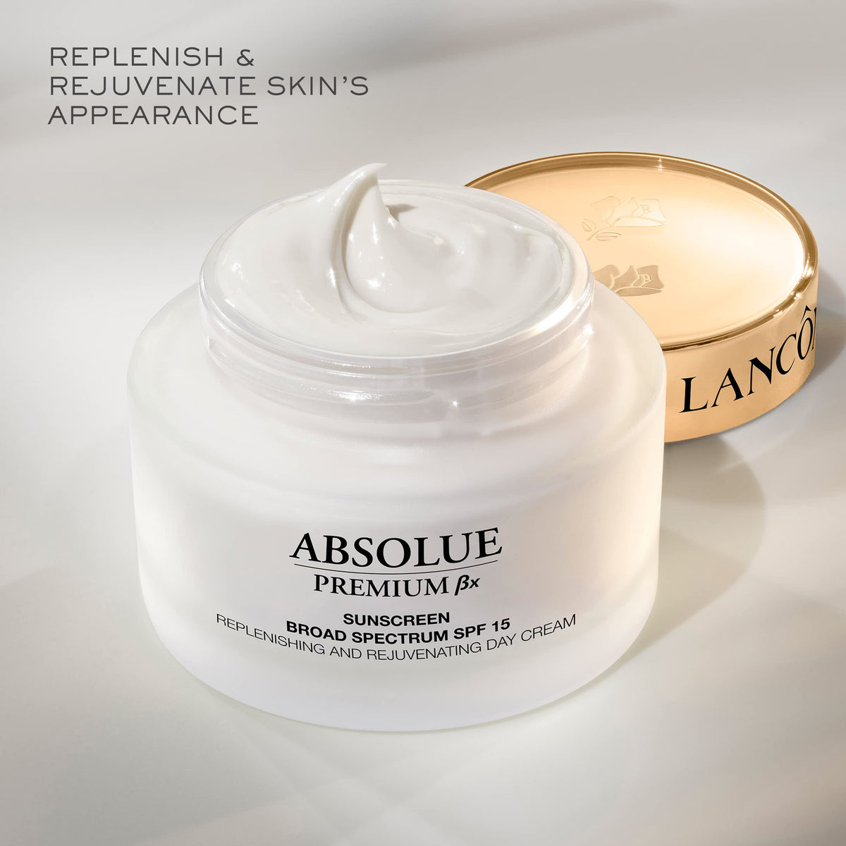 Lancôme Absolue cream applied to hand demonstrating smooth spreadability and instant nourishment benefit