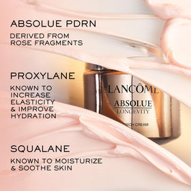 Lancôme Absolue refill cartridge being inserted into jar for easy replenishment