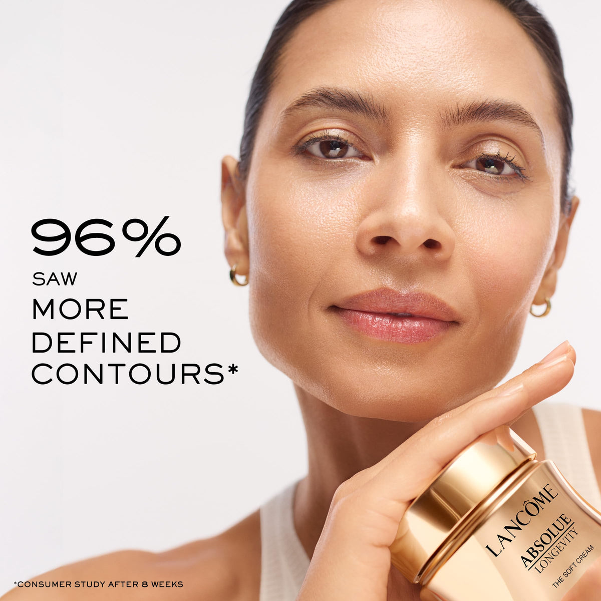 Lancôme jar beside coin showing size and travel-friendly benefit