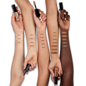 Lancôme concealer texture swatch on skin showing creamy blendable finish and hydration benefit
