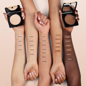 Lancôme sponge applying damp product to show cream-like coverage benefit