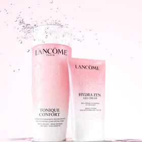 Lancôme travel-sized jar next to passport illustrating portability