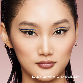 Lancôme liner applied on model eye showing crisp green wing for long-lasting definition