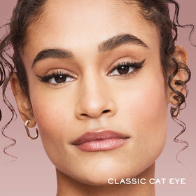 Lancôme on vanity mirror during routine applying long-wear liner for confident look