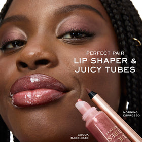 Lancôme gloss in a purse lifestyle photo for quick on-the-go touch-up benefit