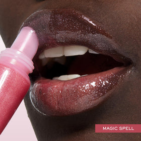 Lancôme gloss layered over lipstick illustrating enhanced color and luminous finish