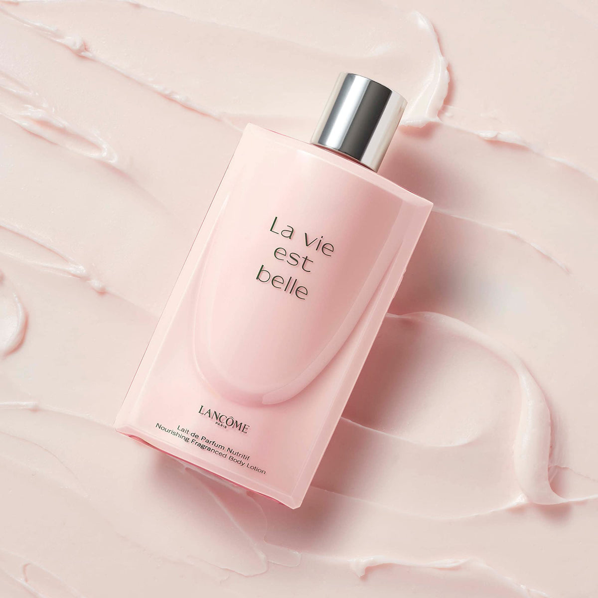Lancôme applying lotion on arm showing soft hydrated skin benefit