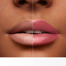 Lancôme lipstick beside coin for scale to show size and portable elegance
