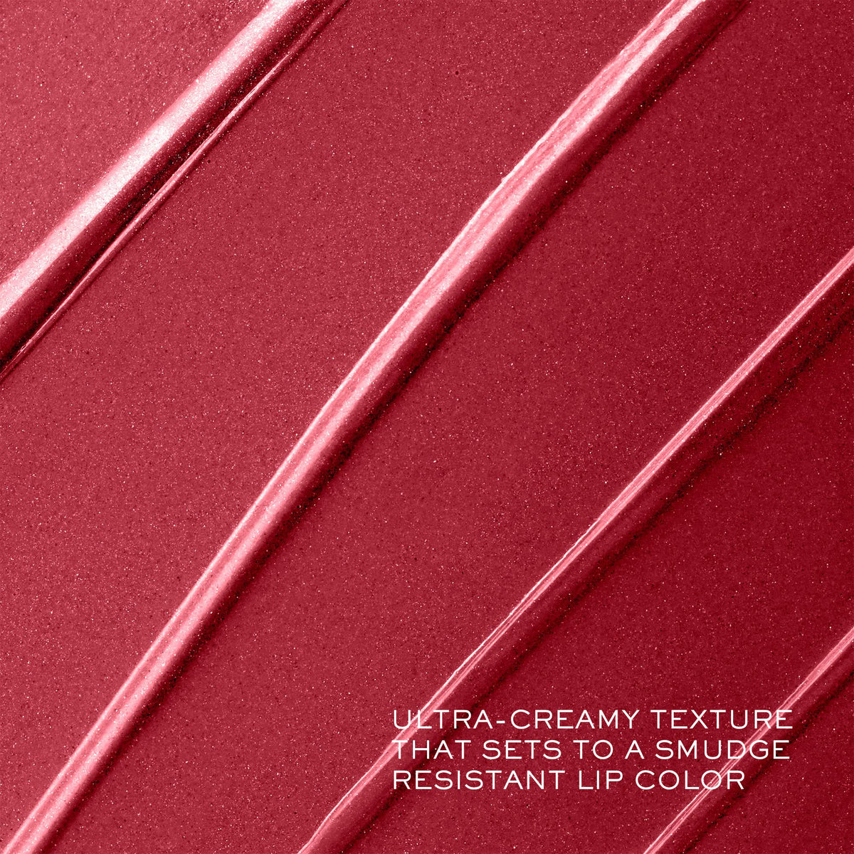 Lancôme lipstick beside coin to show compact size and portability