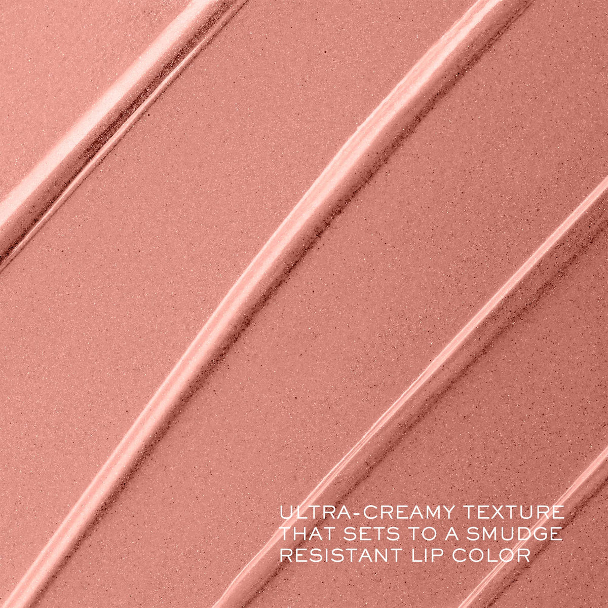 Lancôme tube beside fingers showing compact size and travel-friendly benefit