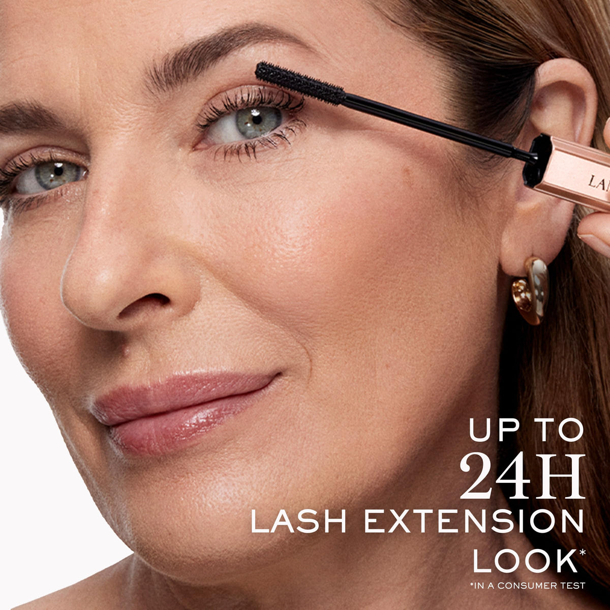 Lancôme model portrait wearing mascara highlighting fluttery, extended lashes