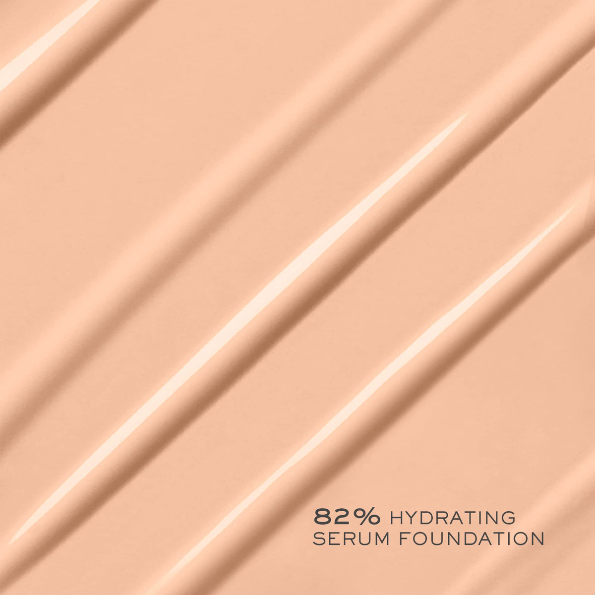 Lancôme lifestyle image of woman applying foundation for effortless glow