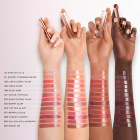 Lancôme Butterglow in a purse setting portraying on-the-go hydration and quick touch-ups