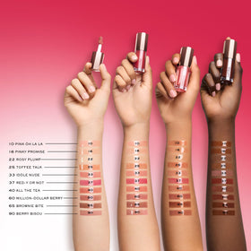 Lancôme JuicyTreat next to coin illustrating size and travel-friendly convenience