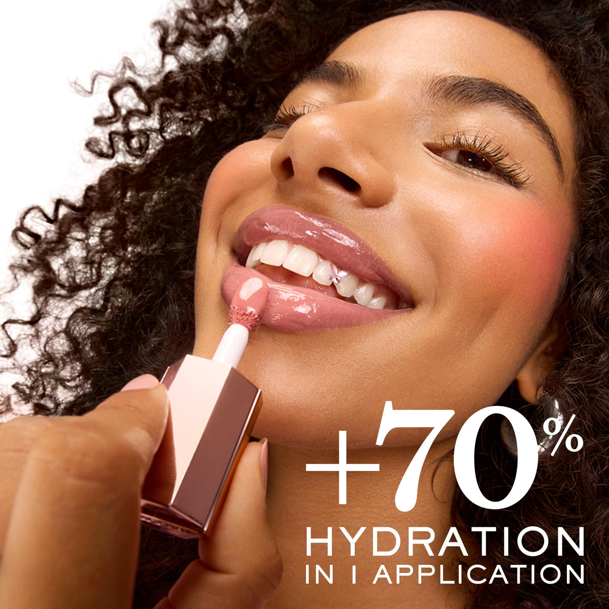 Lancôme glossy texture swirl of JuicyTreat showing oil-in-gloss sheen benefit