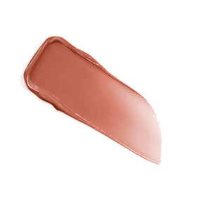 Lancôme product next to common items showing compact size for portability