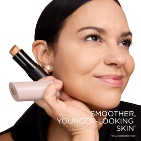 Lancôme shape stick tucked in a makeup bag showing travel‑ready convenience and portability