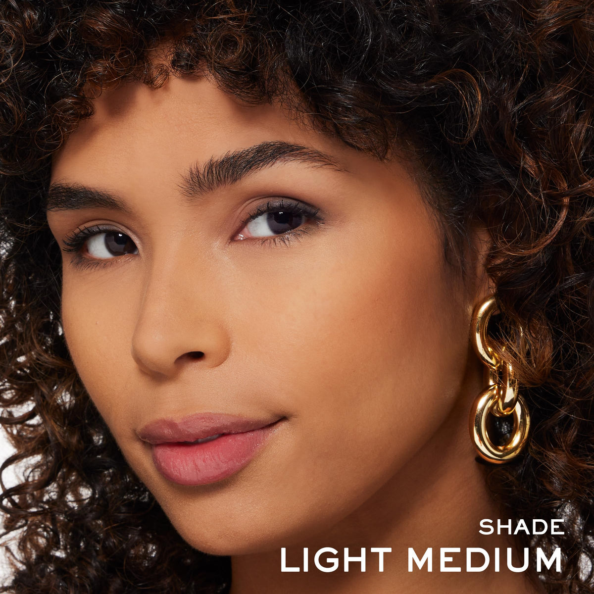 Lancôme swatch of 03 Light Medium on forearm showing natural warmth