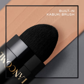 Lancôme stick inside makeup bag lifestyle scene showing on-the-go touchup benefit