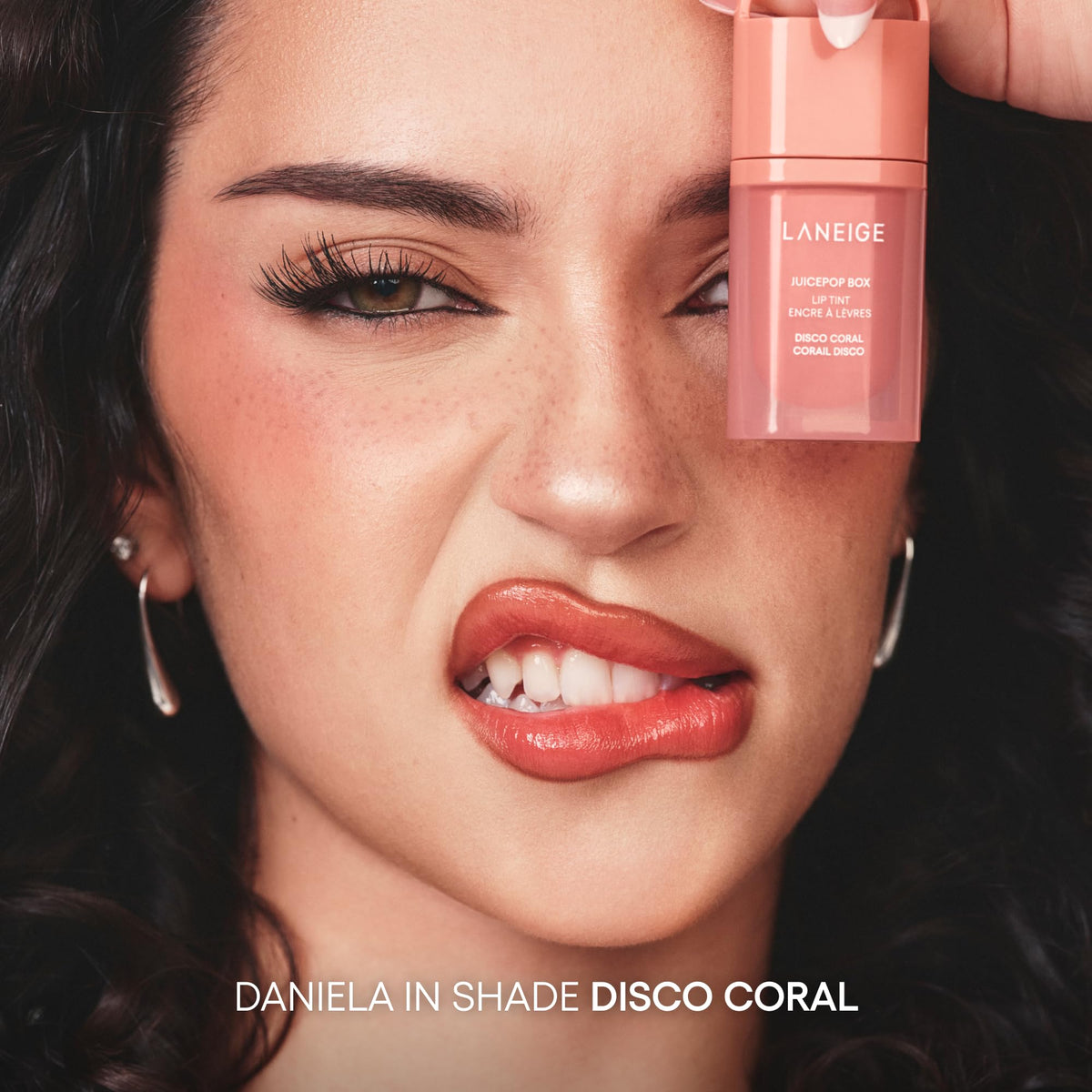 LANEIGE model wearing Disco Coral showing brightening lip effect