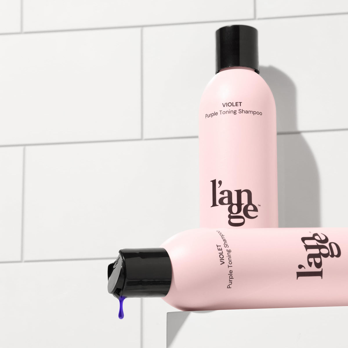 L'ANGE HAIR bottle placed in bathroom setting demonstrating daily use