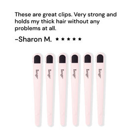 L'ANGE HAIR clips holding hair sections in a salon, boosting styling efficiency